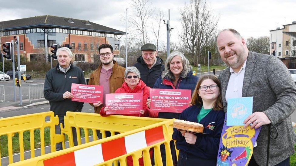 Activists at roadside in Mead Way, Swindon