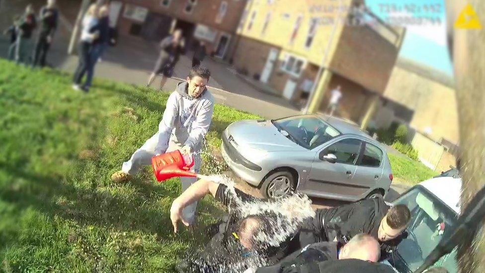 Essex Police officers doused in petrol