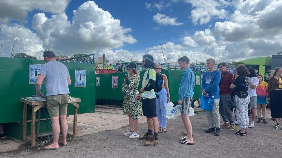 People in a queue for the water supply