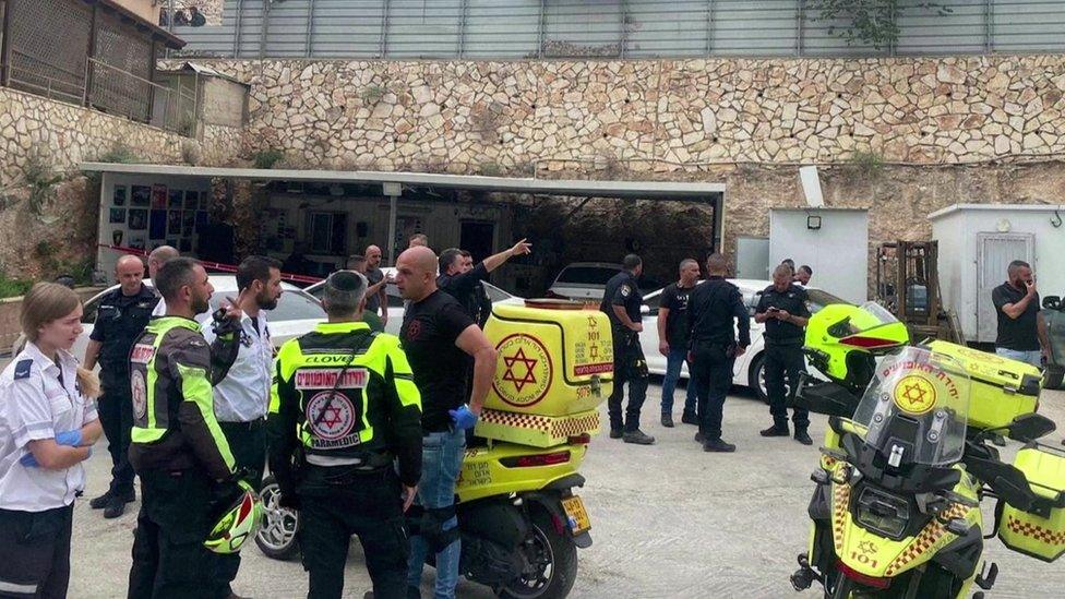 Members of Israel's Magen David Adom ambulance service and police at the scene of a suspected criminal attack in which five people were shot dead in Yafa an-Naseriyye, a south-western suburb of Nazareth, Israel (8 June 2023)