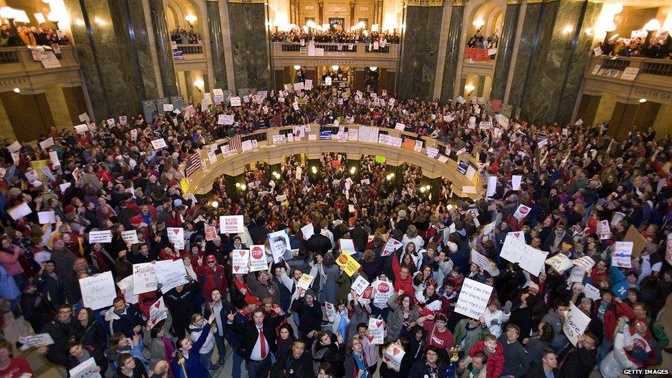 : Protesters fill the Rotunda at the State Capitol building in Madison, Wisconsin. Protesters were demonstrating against Wisconsin Gov. Scott Walker's proposal to eliminate collective bargaining rights for many state workers.