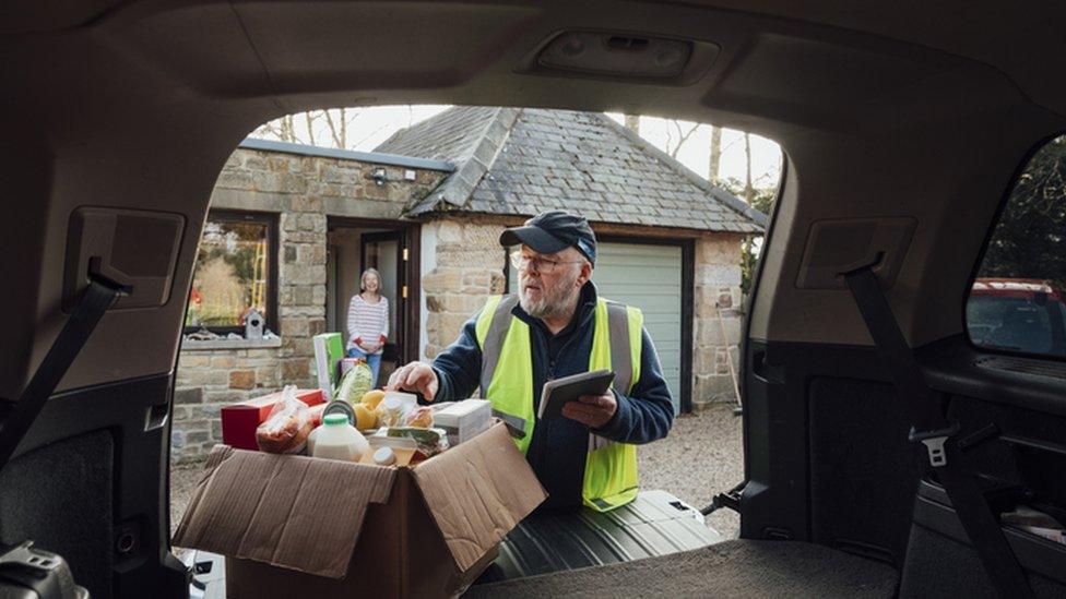 man delivering groceries