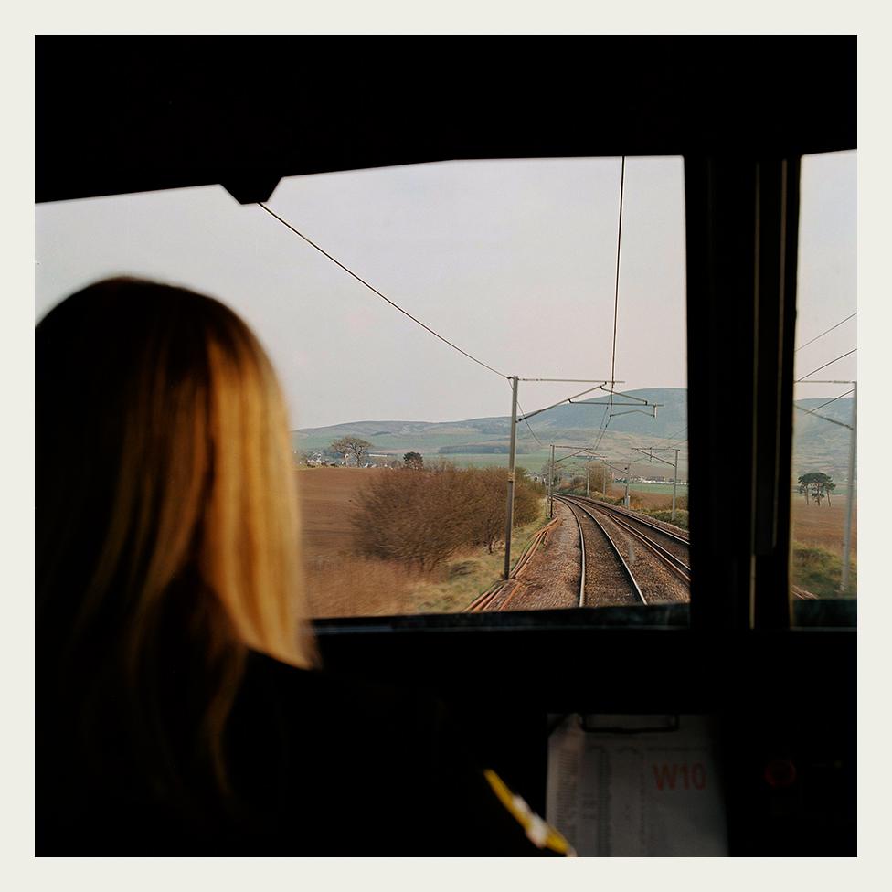 Heather Waugh drives a Class 90 locomotive through lowland Scotland