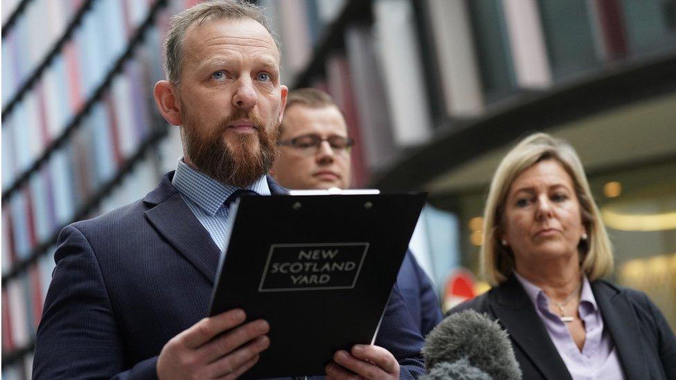 A man in the middle of reading out a statement