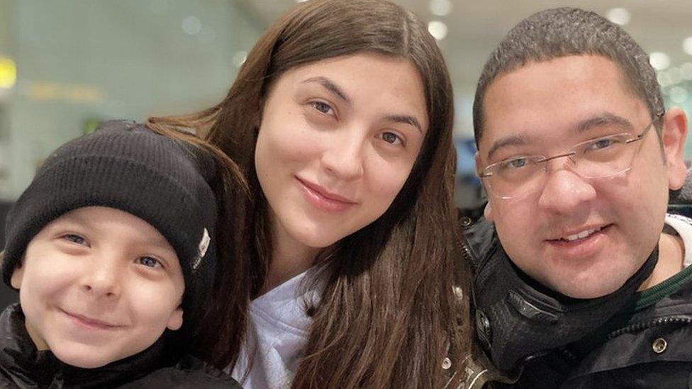 Nathan Rossiter, his wife Olena and son Leo arriving in England