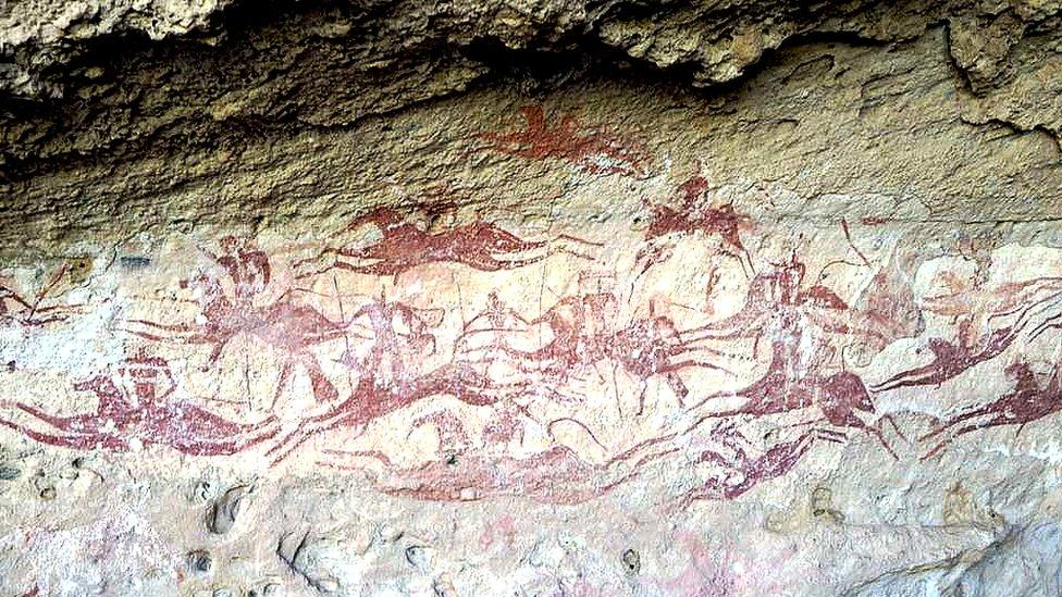 Horses and riders depicted in a cave painting in Ennedi