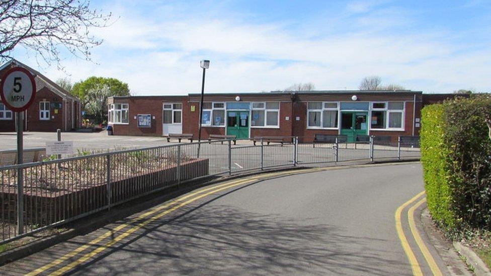 Police are investigating a report of a man exposing himself outside a primary school