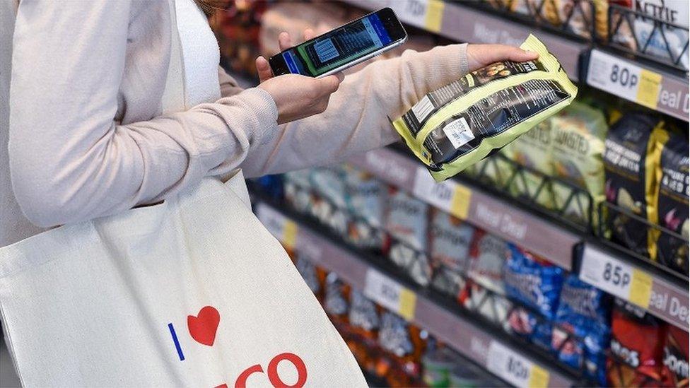 Shopper at experimental Tesco store