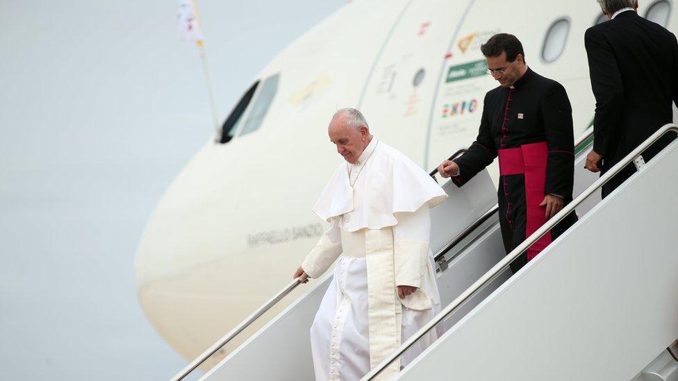 Pope Francis walks down the steps of his plane upon his arrival at Andrews Air Force Base, Md., Tuesday, Sept. 22, 2015, where President Barack Obama was to greet him.