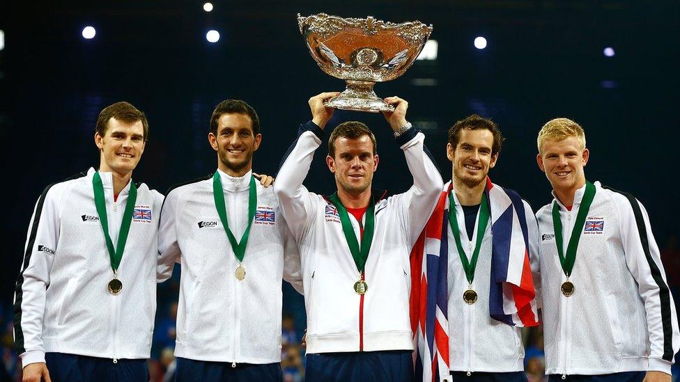 Great Britain Captain Leon Smith lifts the trophy with his team (L-R) Jamie Murray, James Ward, Andy Murray and Kyle Edmund following their victory during day three of the Davis Cup Final match between Belgium and Great Britain at Flanders Expo on November 29, 2015 in Ghent, Belgium.