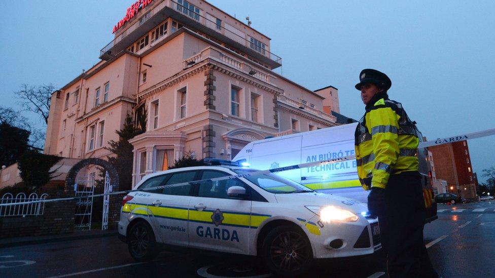 Police officer outside hotel