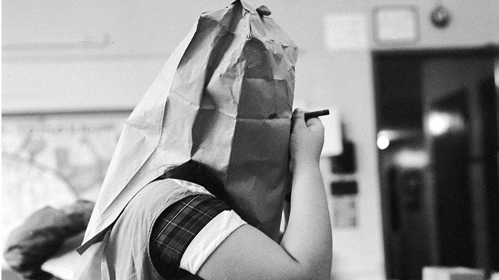 Girl making Halloween mask