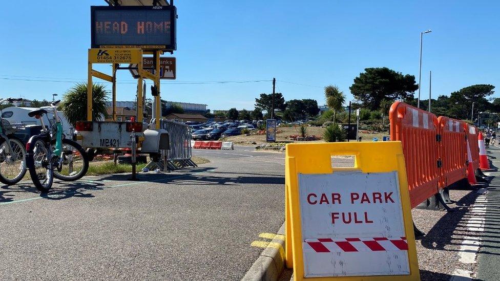 "Head home" sign at Sandbanks