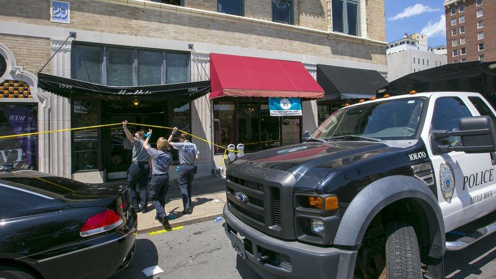 Little Rock Police Department detectives and crime scene personnel collect evidence at the Ultra Power Lounge on July 1, 2017 in Little Rock, Arkansas following a shooting which injured 28 people.