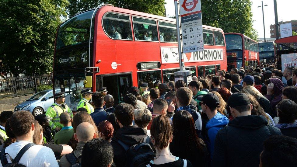 Commuters queue for bus during Tube strike in July 2015