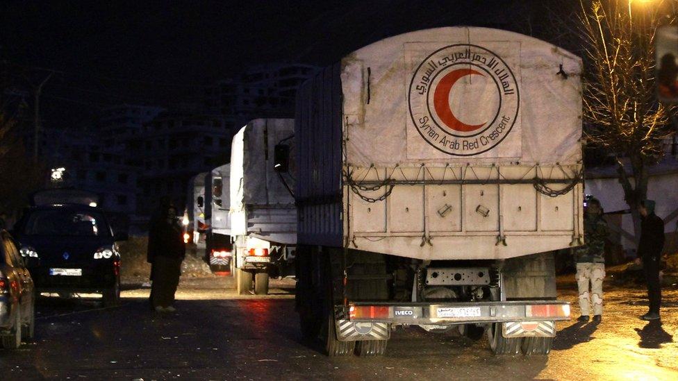 Convoys of aid from the Syrian Arab Red Crescent enters the besieged rebel-held Syrian town of Madaya on 14 January