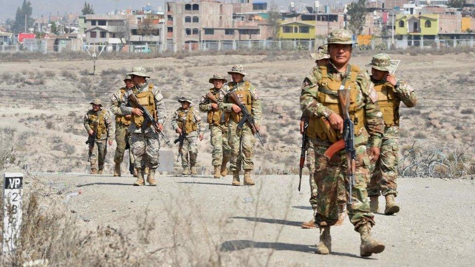 Soldiers guard an area near the Alfredo Rodriguez Ballon International Airport in Arequipa, Peru, 14 December 2022.