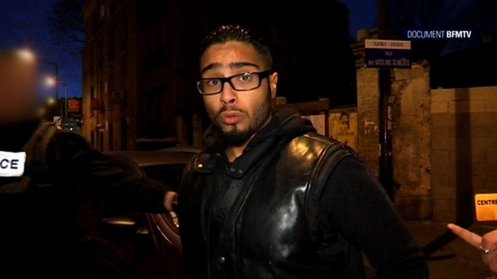 A file image grab from BFMTV footage shows Jawad Bendaoud, the man who allegedly lent his Paris suburb apartment to the suspected ringleader of the attacks on Paris, being arrested in Saint-Denis.