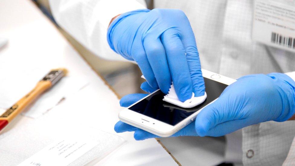 Phone screen being cleaned