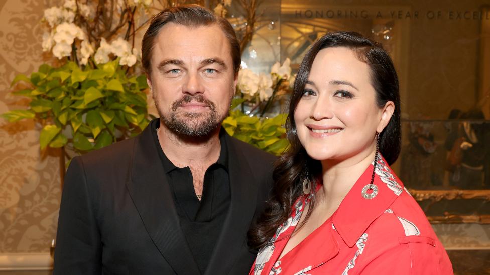 Leonardo DiCaprio and Lily Gladstone attend the AFI Awards at Four Seasons Hotel Los Angeles at Beverly Hills on January 12, 2024 in Los Angeles, California.