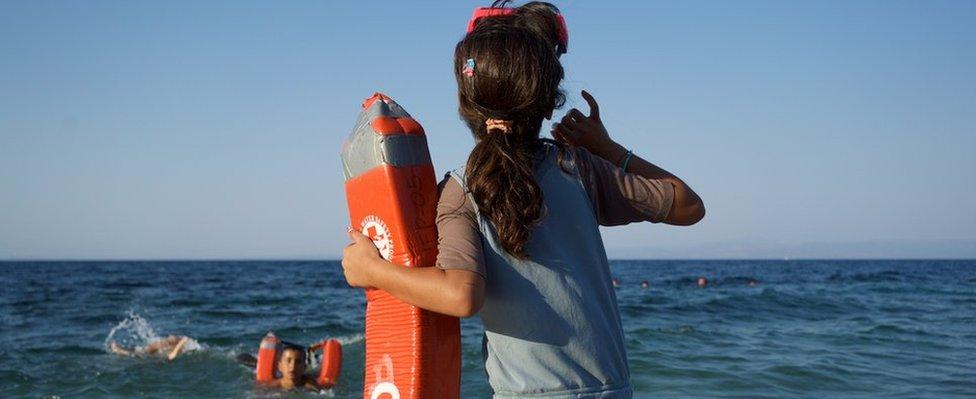 A child looks on during a session