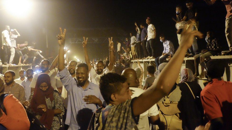 Crowds crossing a bridge to go to a sit-in at the military HQ in Khartoum, Sudan - Monday 8 April 2019