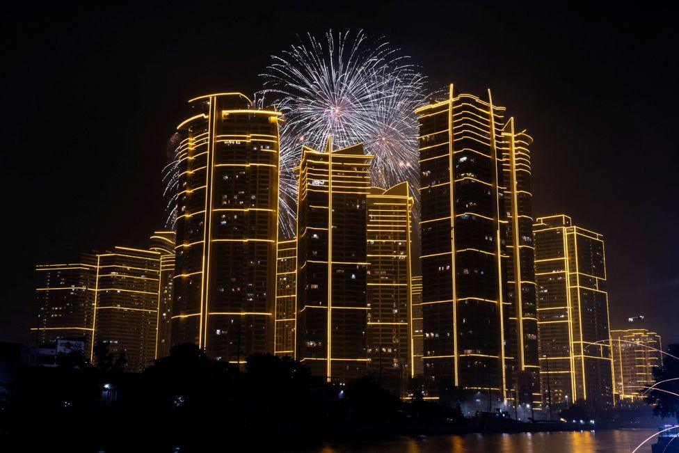 Fireworks explode over Rockwell Center in celebration of the New Year in Mandaluyong City, Metro Manila, Philippines, January 1, 2025. 