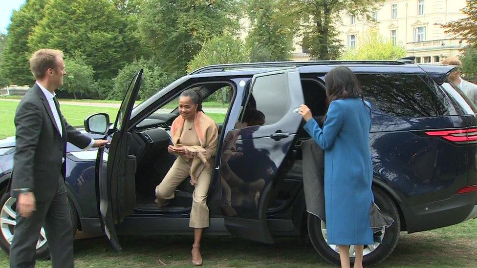 The Duchess shuts her own door as she arrives at a cookbook launch with her mother Doria Ragland