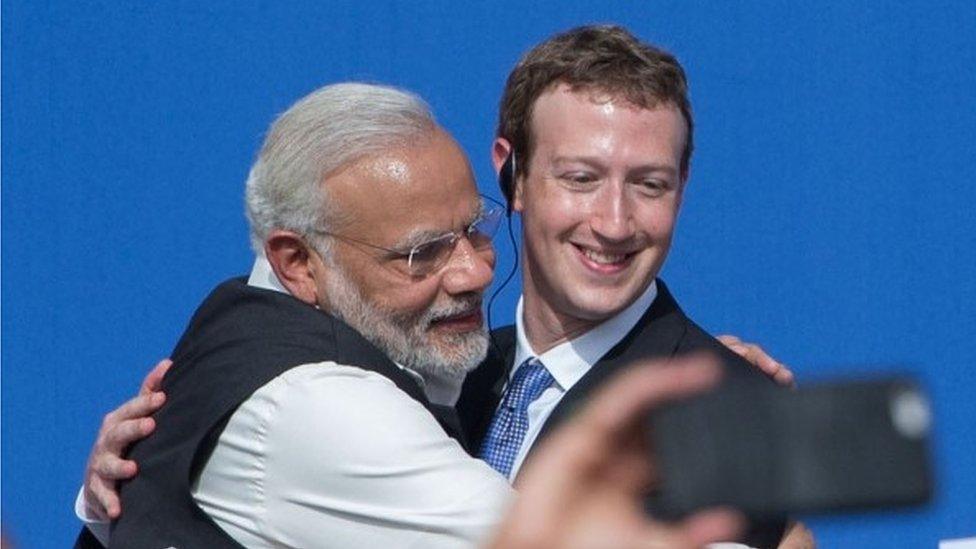 Indian Prime Minister Narendra Modi (L) and Facebook CEO Mark Zuckerberg hug after a Townhall meeting, at Facebook headquarters in Menlo Park, California, on September 27, 2015.