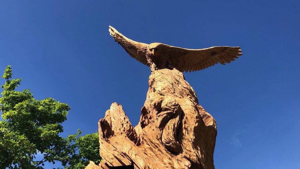 Red kite on top of the carving