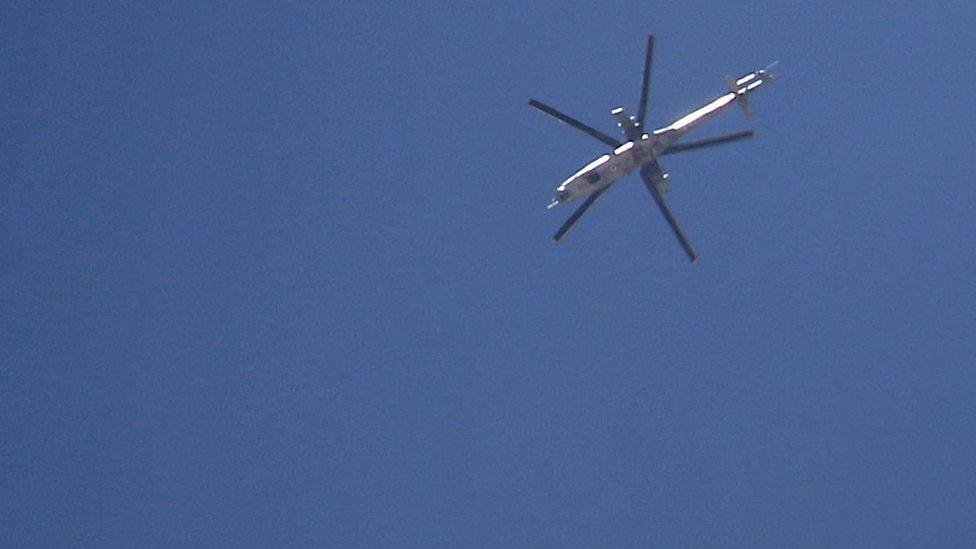 Syrian government Mi-24 helicopter drops a bomb on rebel-held Deraa province on 27 June 2018