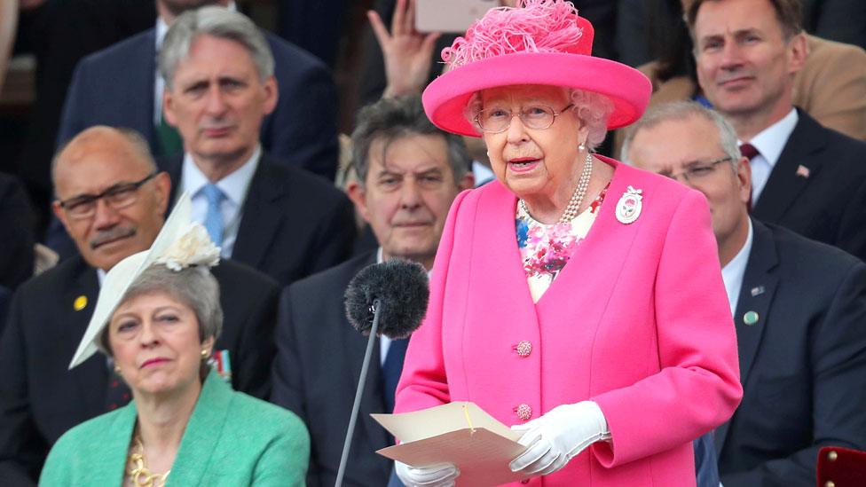 The Queen stands to give a speech