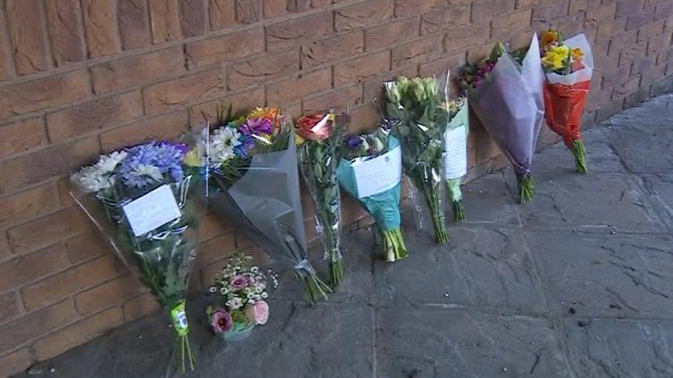 Floral tributes outside Leicestershire Police headquarters