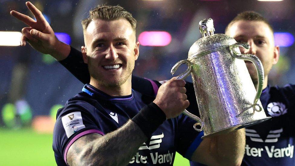 Stuart Hogg holding the Calcutta Cup in 2022