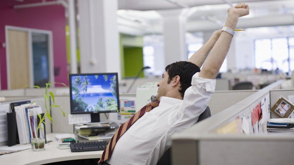 Stretching man in office