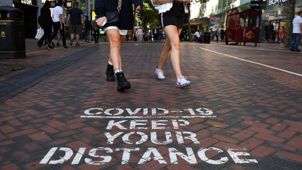 A Covid-19 social distancing public notice on a street in Birmingham