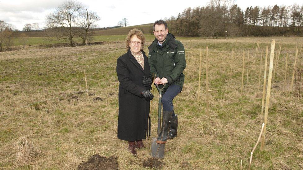 Judith Blake, leader of Leeds City Council, plants the first tree with Adrian Gill, Flood Risk Manager at the Environment Agency