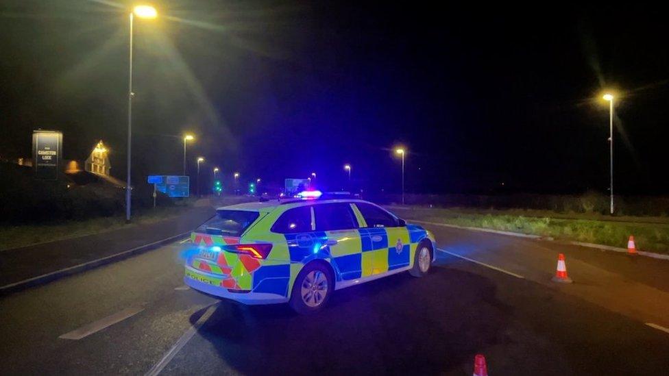 Police car at scene of crash