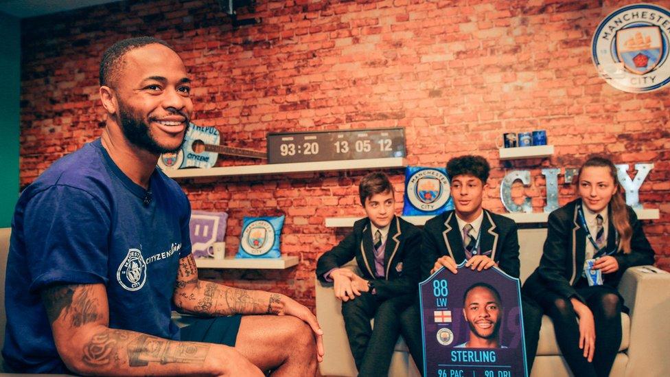 Raheem Sterling and students.