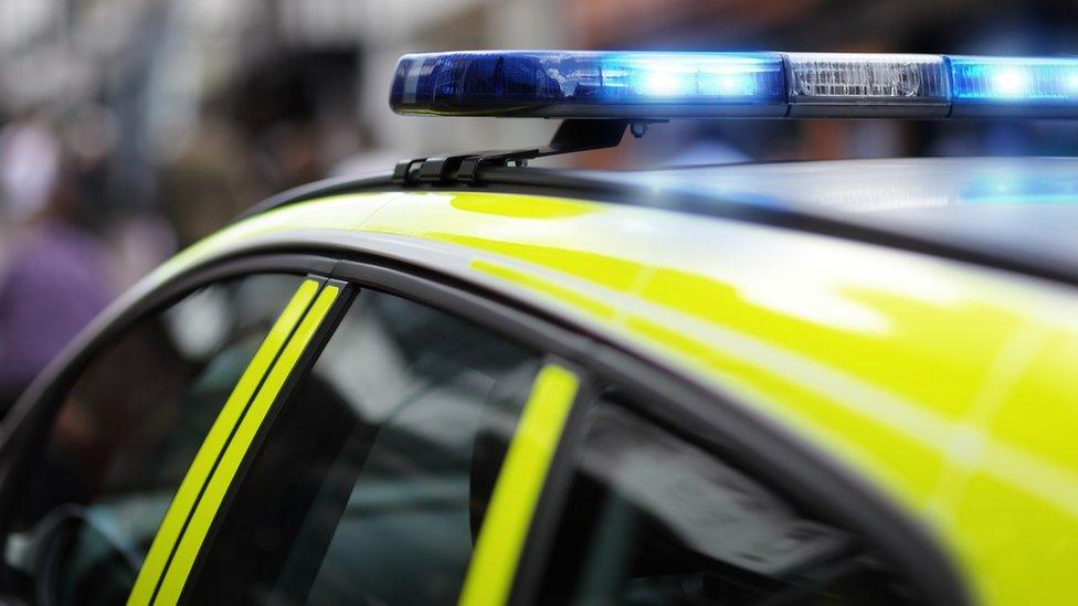 A police car with its blue lights flashing