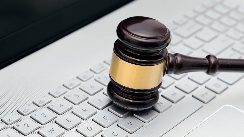 Gavel on computer keyboard