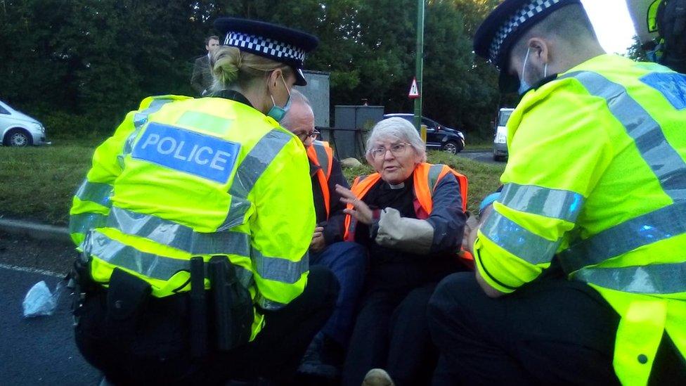 Police talking to a protester