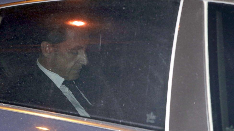 Former French President Nicolas Sarkozy leaves the Paris prosecutor's office in July 2014