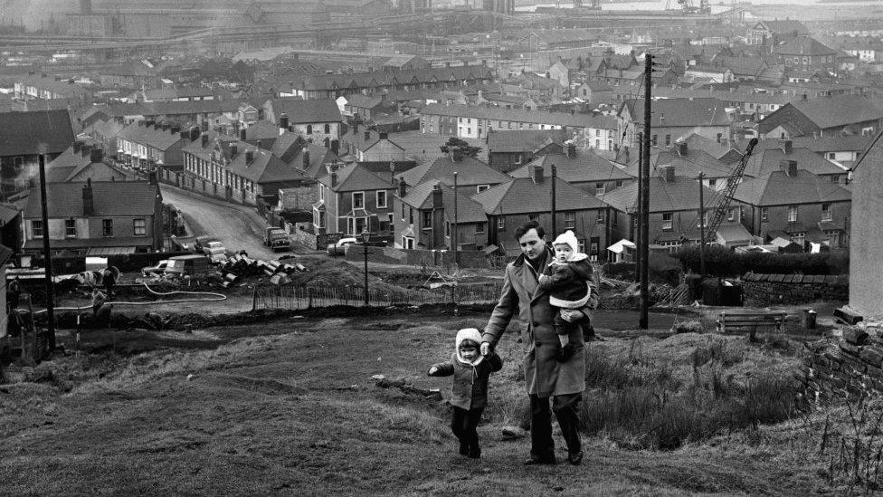 Steelworker and his children walking in 1964