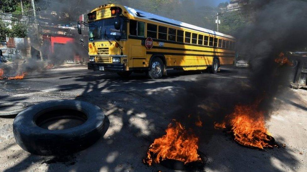 Supporters of the LIBRE opposition party mount burning roadblocks on streets and avenues during protests in Tegucigalpa on January 27, 2019. -