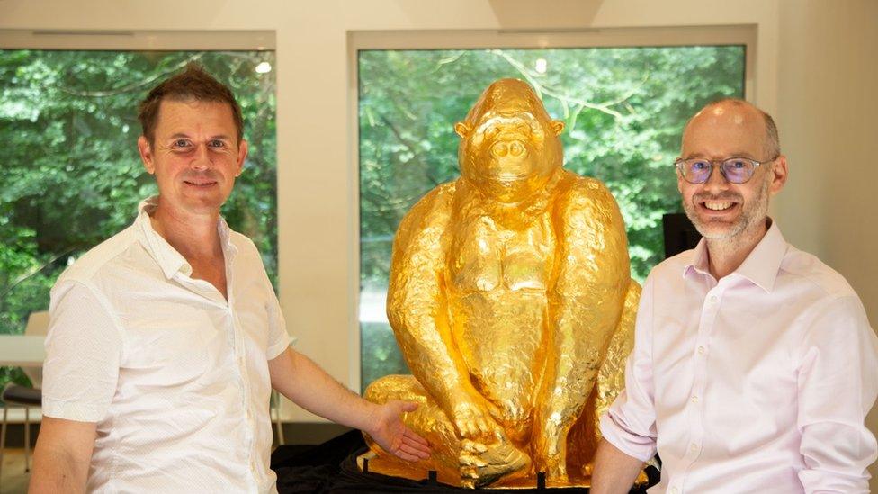 Artist Luke Jerram (L) and Justin Morris, CEO of Bristol Zoological Society, with Alfred the chocolate gorilla