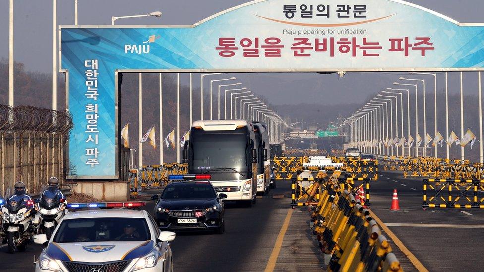 A coach carrying the North Korean delegation arrives at Grand Unification Bridge, near the DMZ, in Paju, South Korea on 21 January 2018