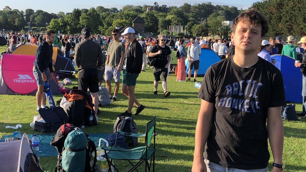 Our reporter Will in the queue