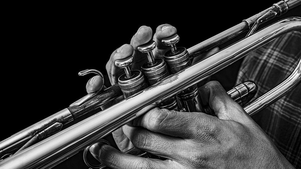 man playing trumpet