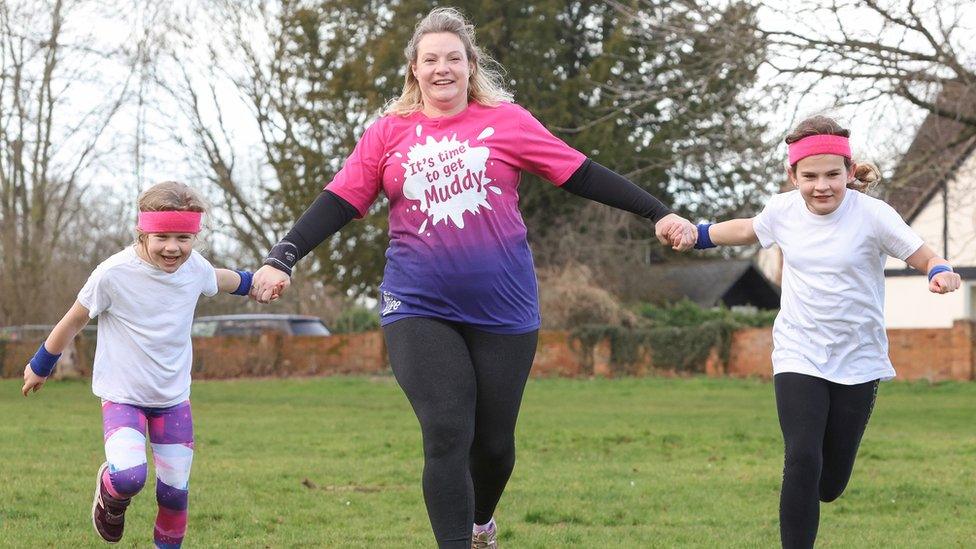 Emma and her two children, Naomi and Alan running